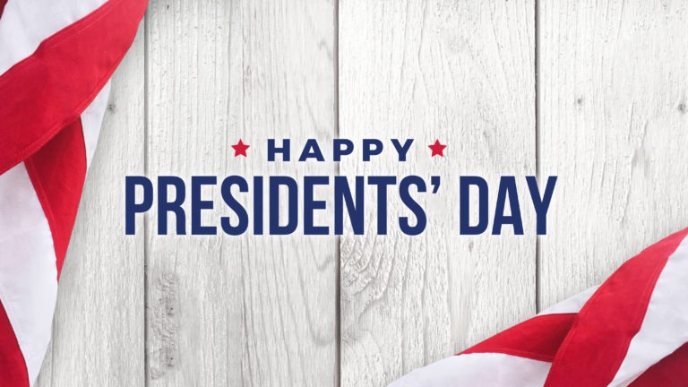 Happy Presidents‘ Day Text with Flags Over White Wood
